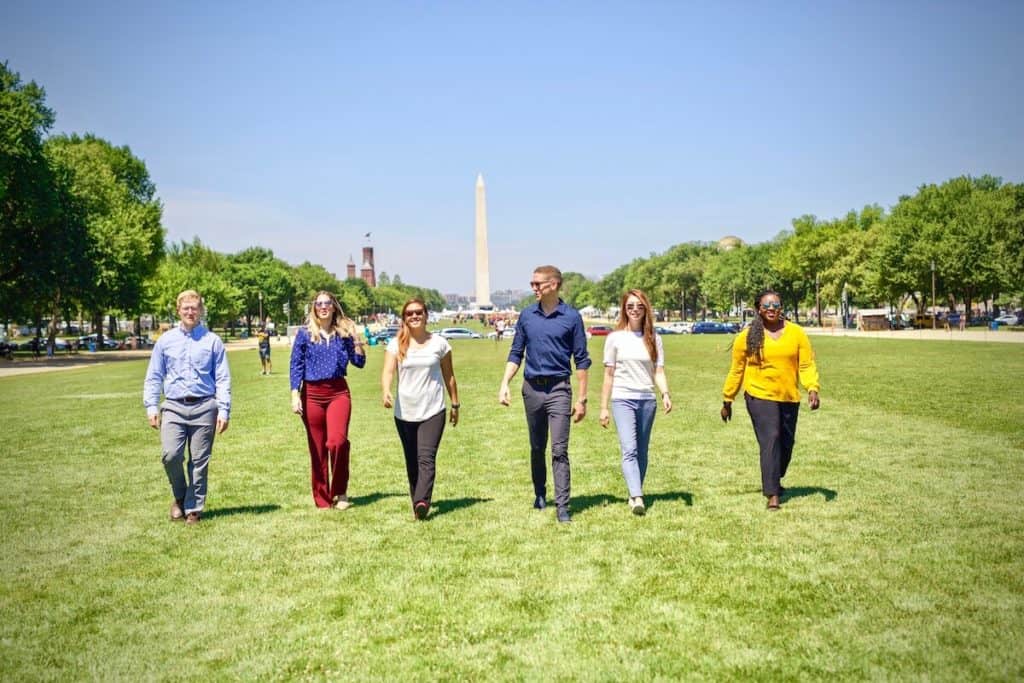 MovementX team of physical therapists walking in front of Washington Monument in Washington DC
