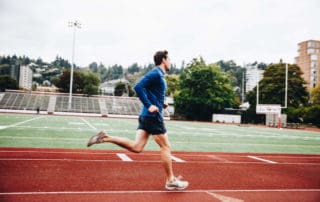 MovementX man running on track