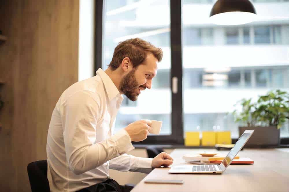 Man slumped at computer with bad posture