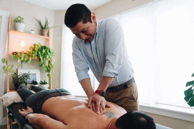 Manual therapy on upper back with physical therapy