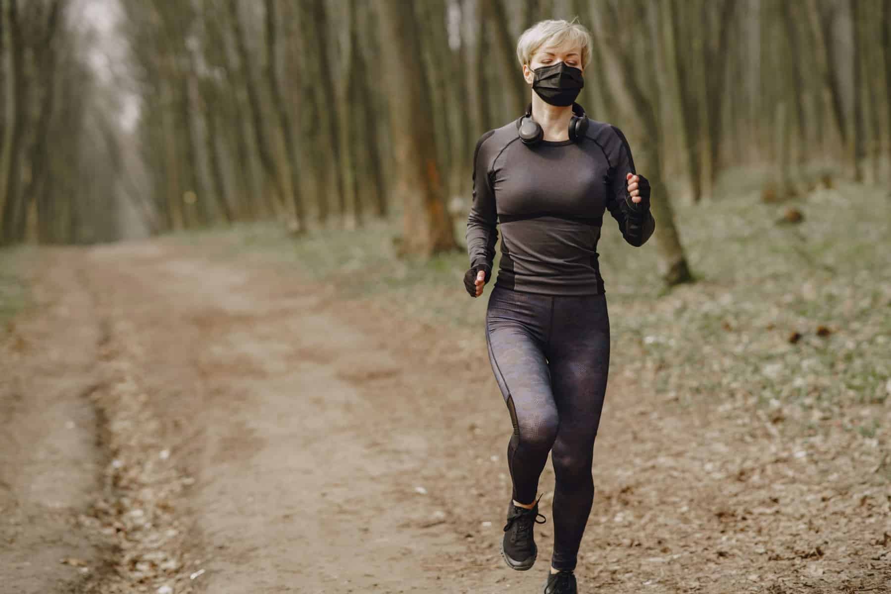 Physical therapy patient running in mask