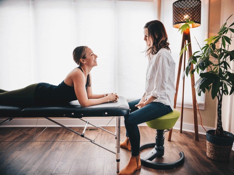 MovementX physical therapist teaching a woman how to strengthen her pelvic floor muscles