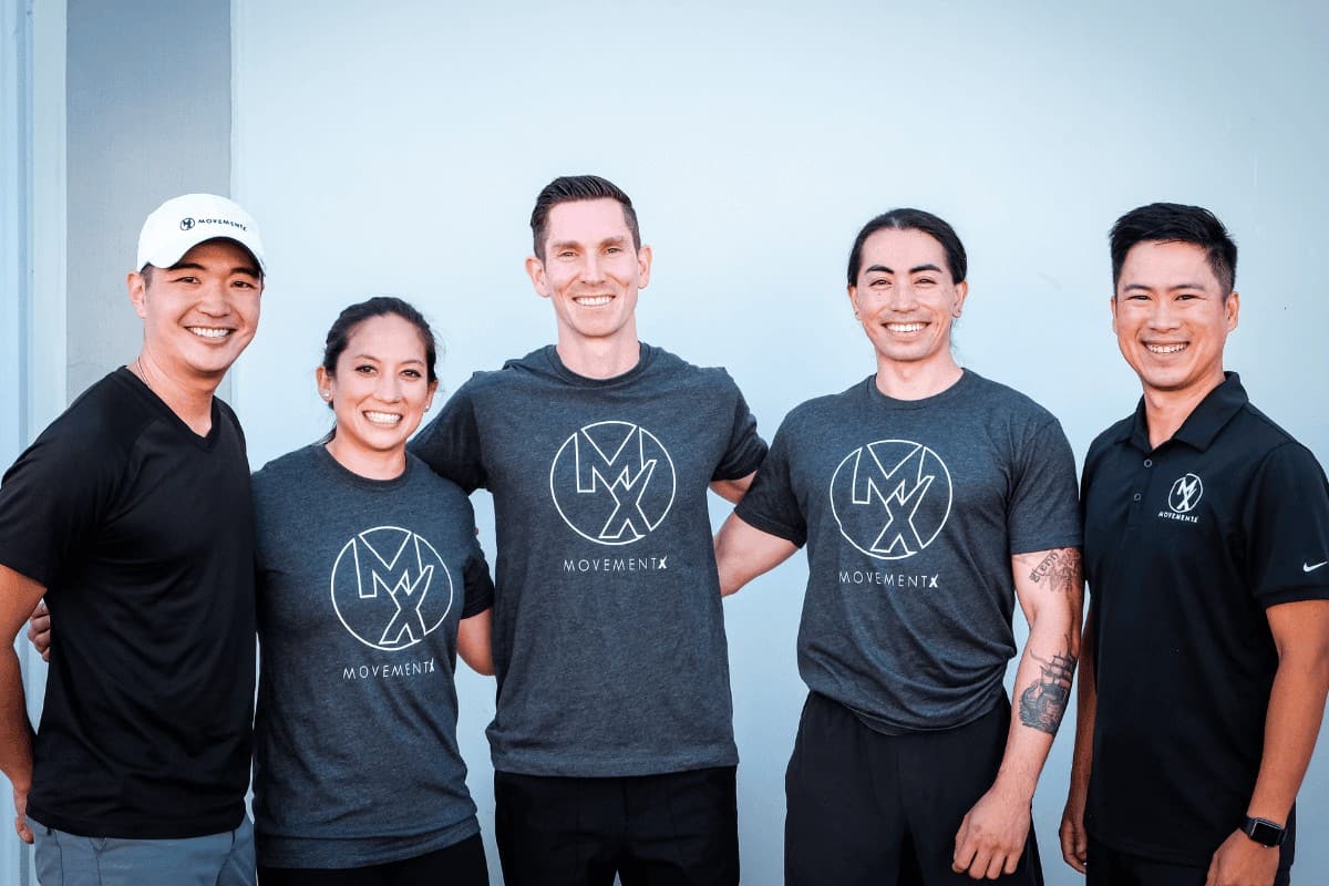 A group of movementx providers smiling together as a team