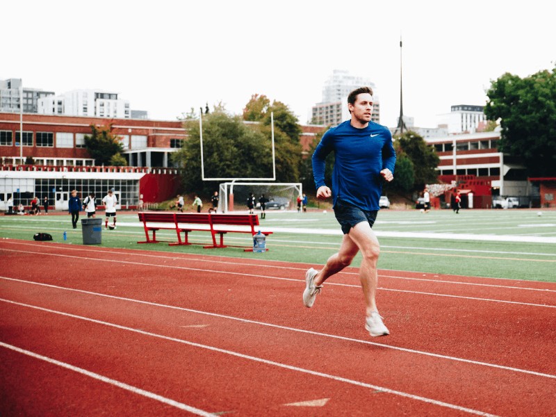 a runner striding confidently down a track in northern virginia