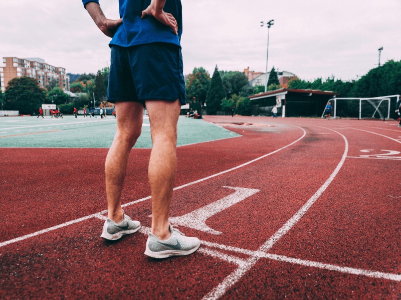 a runner at the starting line on a local track in fairfax virginia