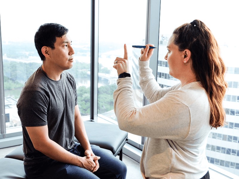 MovementX provider Alicia Keefe examining a patient for neurological care in Maryland.