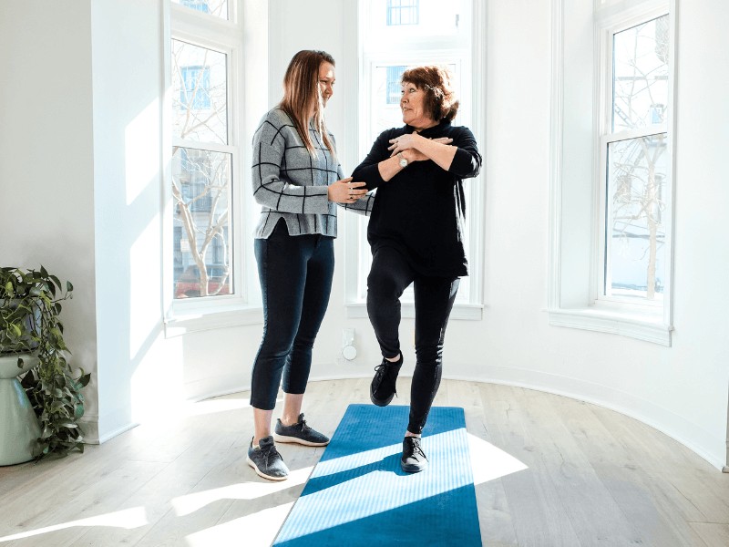 MovementX provider KT Prominski giving a patient physical therapy treatment to improve their balance in Northern Virginia.