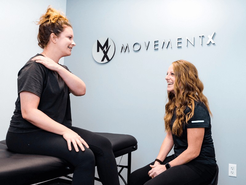 MovementX Physical Therapist Dr. Lauren O'Shea PT, DPT treating a patient in a MovementX treatment room.