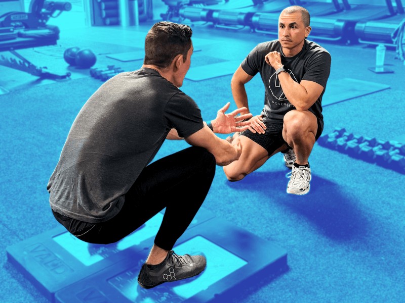 Dr. Derek Garza, PT, DPT helping a patient diagnose their ankle injuries in a multi-use gym.