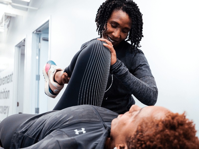 MovementX Provider Suzanne Cowan treating a patient on a treatment table in Washington, D.C.