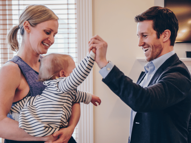 Josh D'Angelo, PT, DPT and MovementX Founder/CEO high fiving a baby.