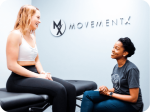 A movementx physical therapist performing her first subjective interview with a new patient in a clinic setting