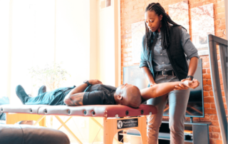 A movementx physical therapist in maryland working with a patient in a home setting