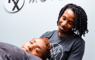 a movementx physical therapist in virginia working with a patient in a clinic setting on neck pain relief