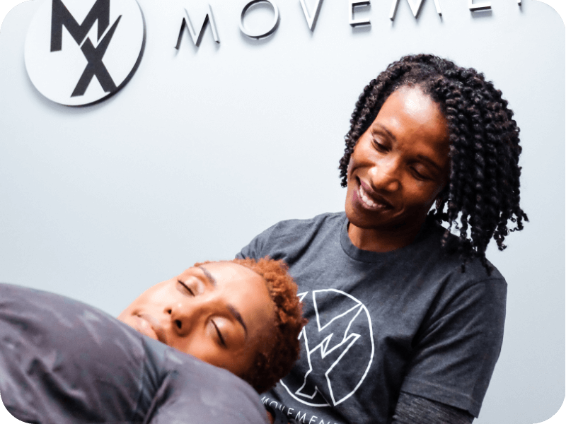 a movementx physical therapist in virginia working with a patient in a clinic setting on neck pain relief