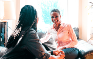 two movementx physical therapists talking with each other and enjoying their flexible PT careers