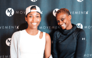 two newly hired movementx physical therapists who are excited about their new PT jobs in maryland in front of a movementX sign