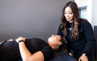 a movementx physical therapist in oregon treating a patient with neck pain in a PT clinic setting