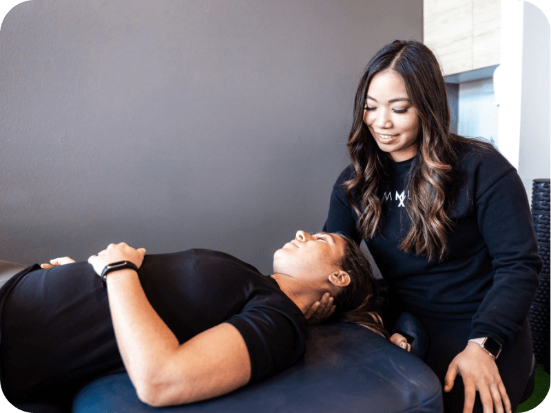 a movementx physical therapist in oregon treating a patient with neck pain in a PT clinic setting