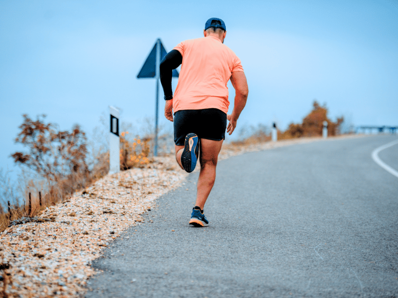 Our fictional patient, John, running up a hill in his 40s.