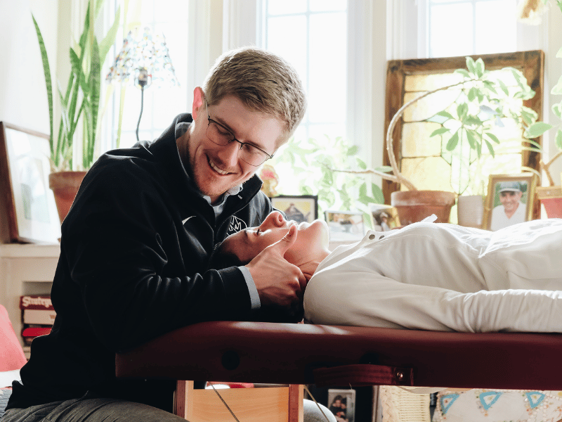 Fred Gilbert, PT, DPT assisting a patient in getting radiculopathy relief in an in-home physical therapy session.