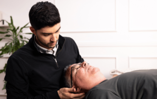 Eric Schulte, PT, DPT helping a patient through an in-home physical therapy session in San Diego California.