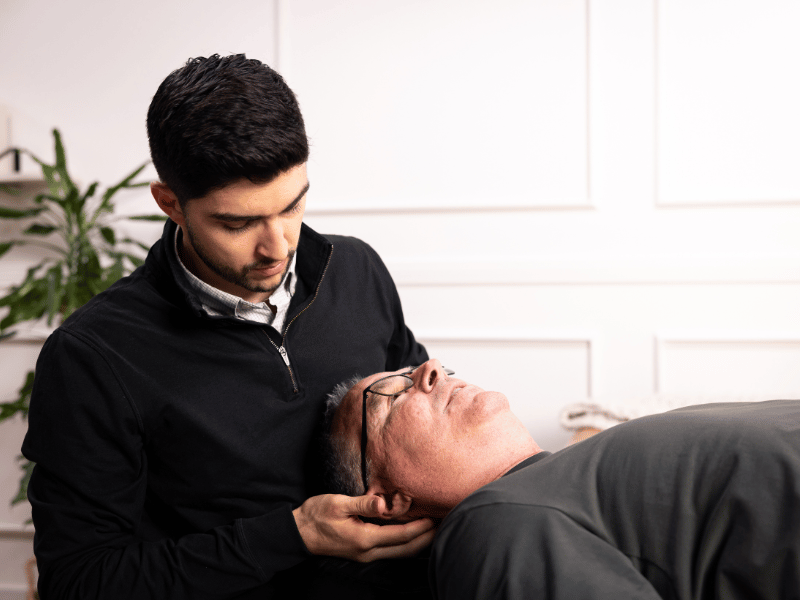 Eric Schulte, PT, DPT helping a patient through an in-home physical therapy session in San Diego California.