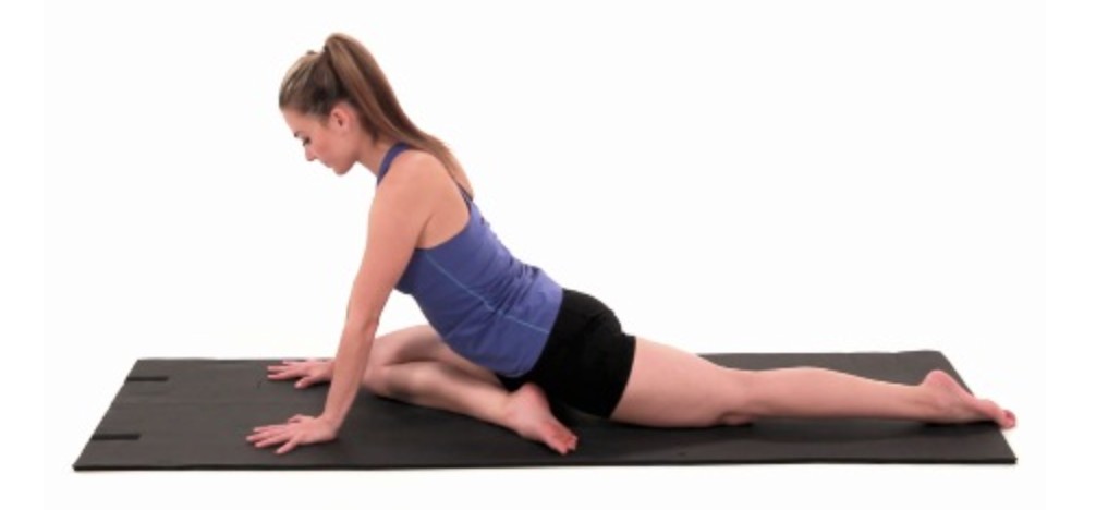 A person performing pigeon stretches for pudendal neuralgia relief.