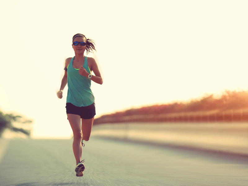 A woman running without hip pain after treatment with a MovementX physical therapist.