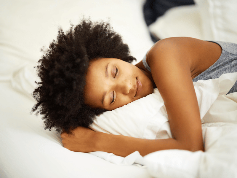 A woman getting great sleep due to an optimized sleep environment.