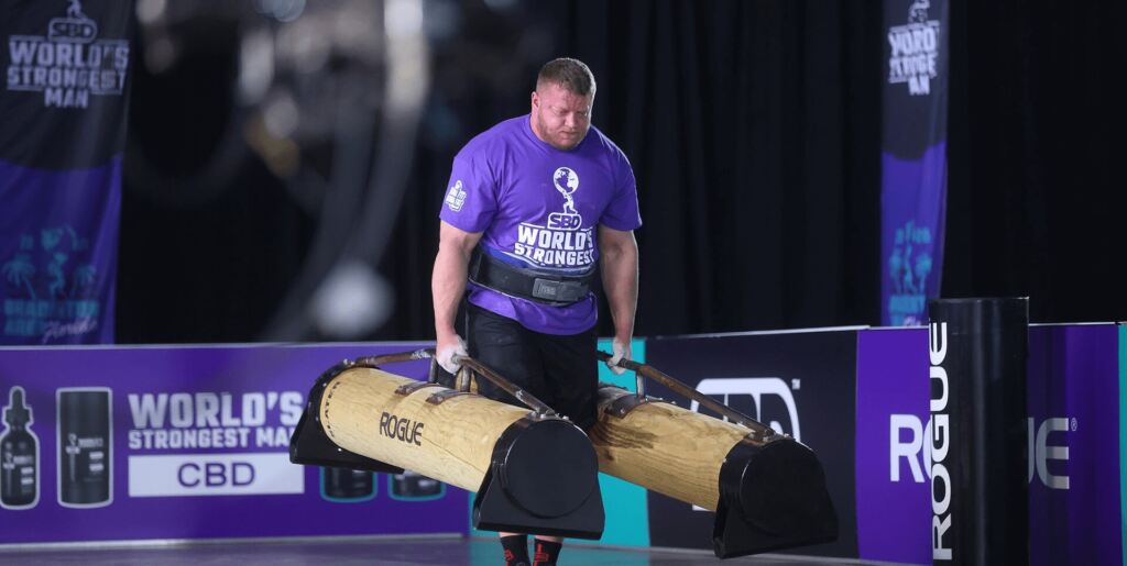 The world's strongest man performing the farmer's walk.