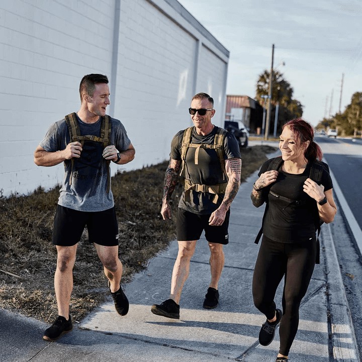 A group rucking together in an urban setting.