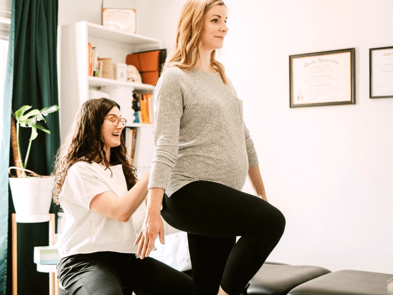 MovementX Physical Therapist Mackenzie Van Loo treating a pregnant mom patient in Bend Oregon with in a PT clinic setting