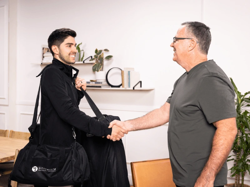 Eric Schulte MovementX Physical Therapist in Del Mar California greeting a male patient for an at home pt session