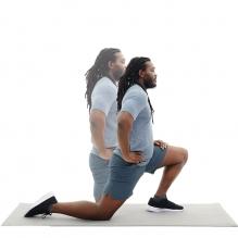 A patient demonstrating the kneeling hip flexor stretch.