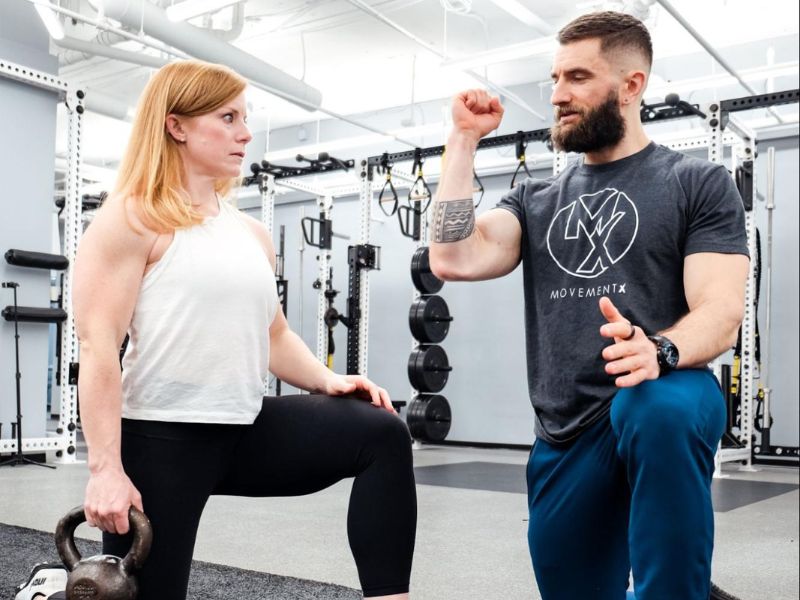 Dr. Matt Syzmanski demonstrating shoulder rotation principles to a patient.