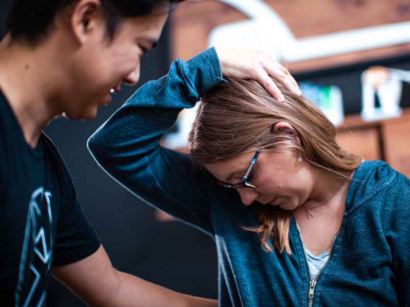 Dr. Peter Nguyen helping a patient mobilize their neck and reduce their CCI symptoms in Orange County, CA.