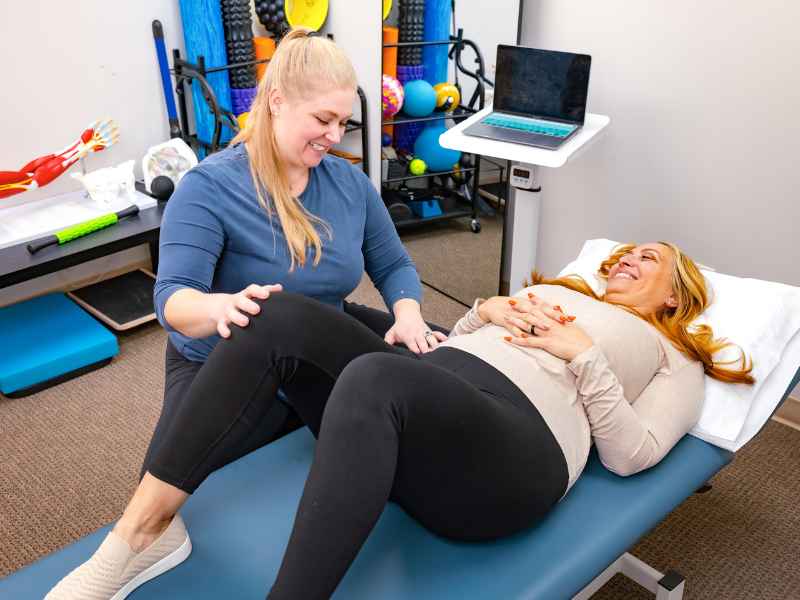 MovementX provider Mattie Overton, PT, DPT helping a patient prepare for pregnancy.