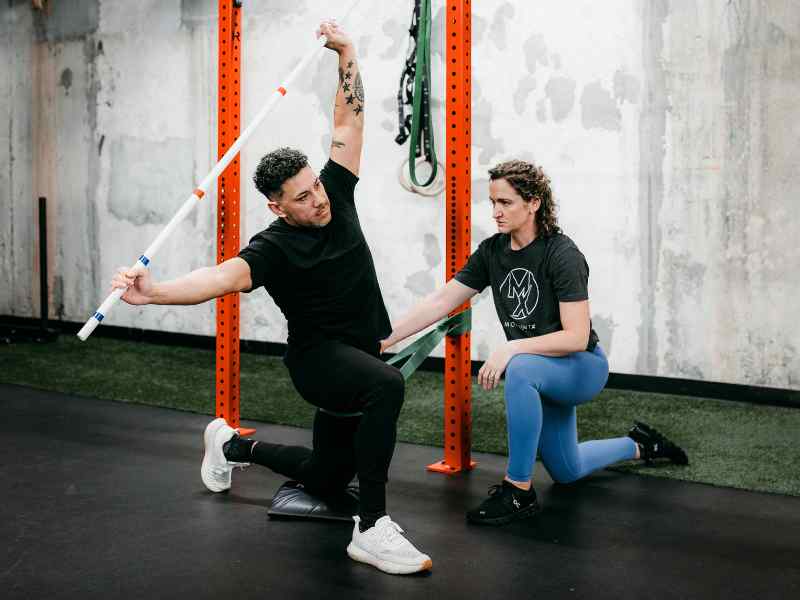 Kristen Lattimore, PT, DPT helping a patient navigate an injury during a physical therapy session in Raleigh, North Carolina.