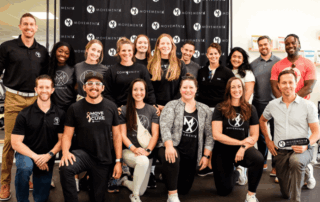a large team of movementx physical therapists enjoying their PT careers with movementX in a PT clinic setting