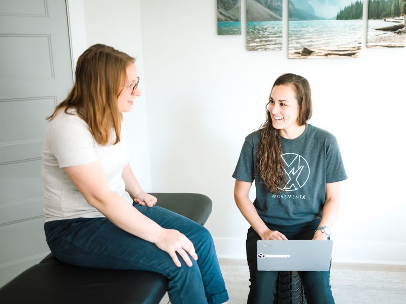 MovementX Provider Ashton Grimm, PT, DPT stepping through an initial consult with a patient in her home in Tennessee.
