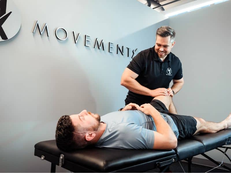 MovementX provider James Cousler, PT, DPT helping a patient through a recovery evaluation.