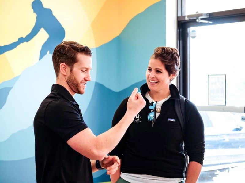 Josh D'Angelo, PT, DPT and co-founder of MovementX speaking with another MovementX provider during a workshop demonstration